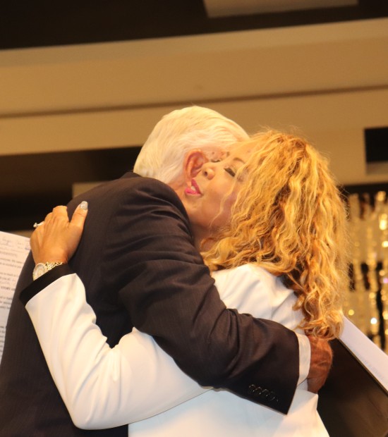Congressman Hoyer hugs Rep. Lucy McBath at the 20th Annual Women's Equality Luncheon