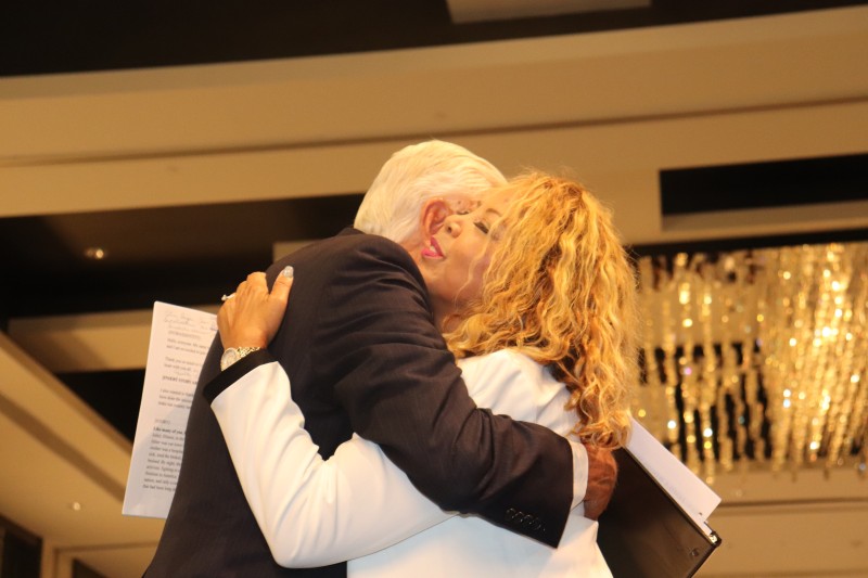 Congressman Hoyer hugs Rep. Lucy McBath at the 20th Annual Women's Equality Luncheon